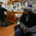 Victor Burch, 40, waits for customers in his barber shop in Livonia, Michigan, U.S. January 24, 2020. Picture taken January 24, 2020. REUTERS/Michael Martina