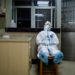A medical worker in protective suit takes a break during her night shift at a community health service center, which has an isolated section to receive patients with mild symptoms caused by the novel coronavirus and suspected patients of the virus, in Qingshan district of Wuhan, Hubei province, China February 9, 2020. Picture taken February 9, 2020. China Daily via REUTERS  ATTENTION EDITORS - THIS IMAGE WAS PROVIDED BY A THIRD PARTY. CHINA OUT.     TPX IMAGES OF THE DAY