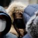 People wearing masks after the coronavirus outbreak wait in a line to buy masks in front of a department store in Seoul, South Korea, February 28, 2020.    REUTERS/Kim Hong-Ji