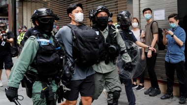 Riot police officers detain a demonstrator during a protest against the second reading of a controversial national anthem law in Hong Kong, China May 27, 2020. REUTERS/Tyrone Siu