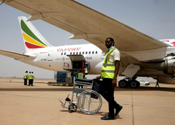 An airport worker pushes a wheelchair after an Ethiopian Airlines aircraft arrived at the newly renovated Kaduna airport in Kaduna, Nigeria March 8, 2017. REUTERS/Afolabi Sotunde - RTS11ZG6