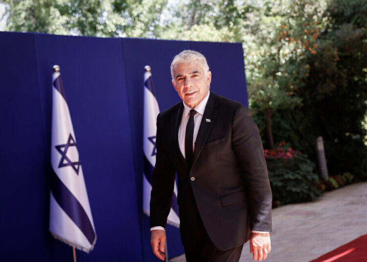 Israel's new Foreign Minister Yair Lapid arrives to a group photo of the newly sworn in Israeli government at the president's residence in Jerusalem on June 14, 2021. Photo by Yonatan Sindel/FLASH90 *** Local Caption *** ממשלת שינוי
בית הנשיא
יאיר לפיד
שר החוץ